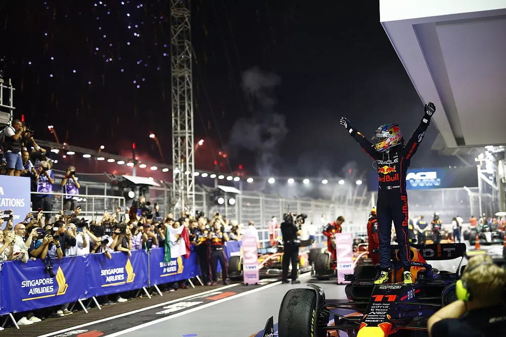 Fireworks light the sky as Sergio Perez, Red Bull Racing, 1st position, celebrates in Parc Ferme
