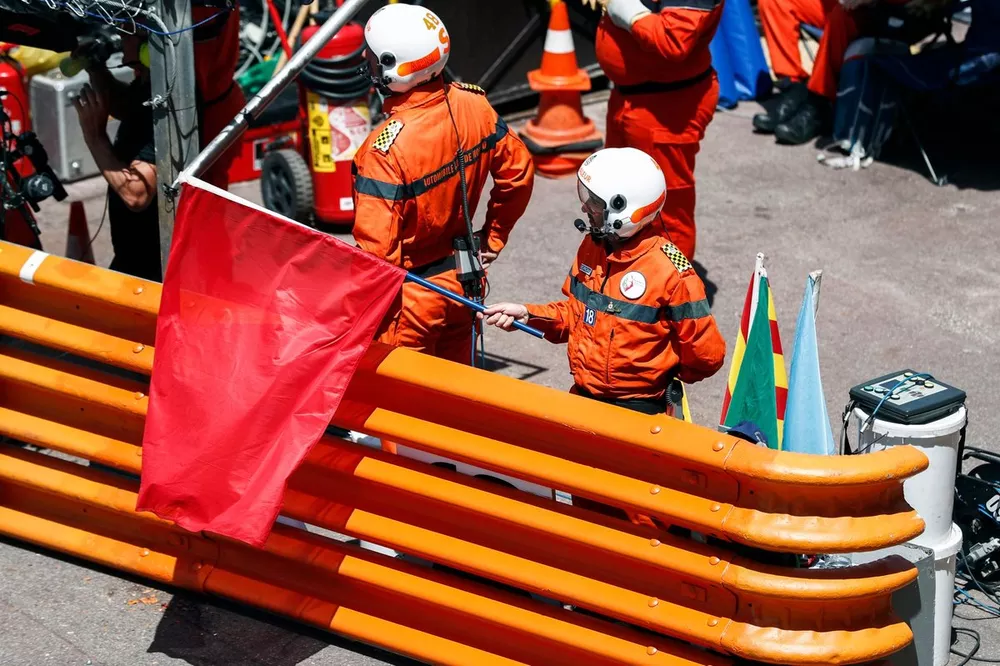 Marshals wave a red flag