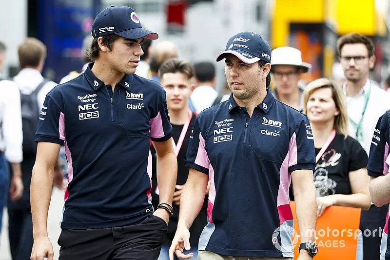 Lance Stroll, Racing Point y Sergio P&eacute;rez, Racing Point en el paddock 