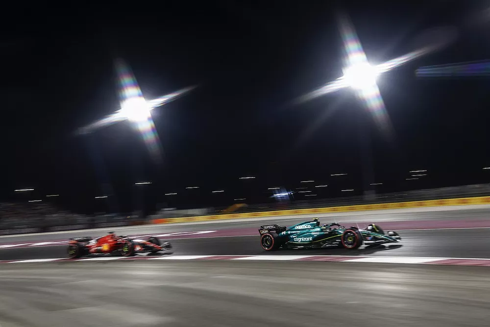 Fernando Alonso, Aston Martin AMR23, leads Charles Leclerc, Ferrari SF-23