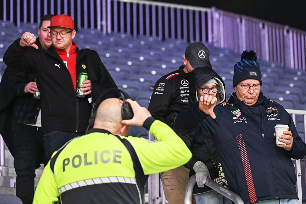 Police eject fans from a grandstand