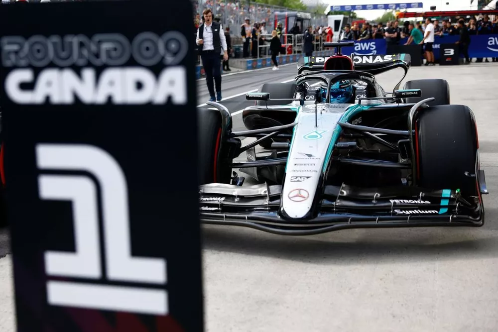 Pole man George Russell, Mercedes F1 W15, pulls up to the first place parking spot in Parc Ferme 