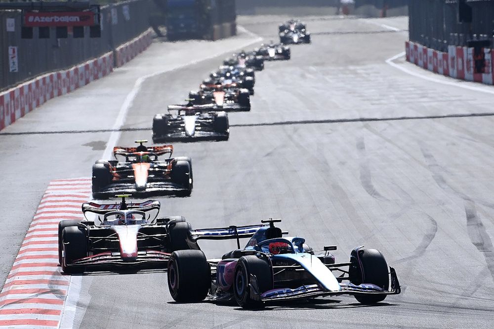 Esteban Ocon, Alpine A523, leads Nico Hulkenberg, Haas VF-23