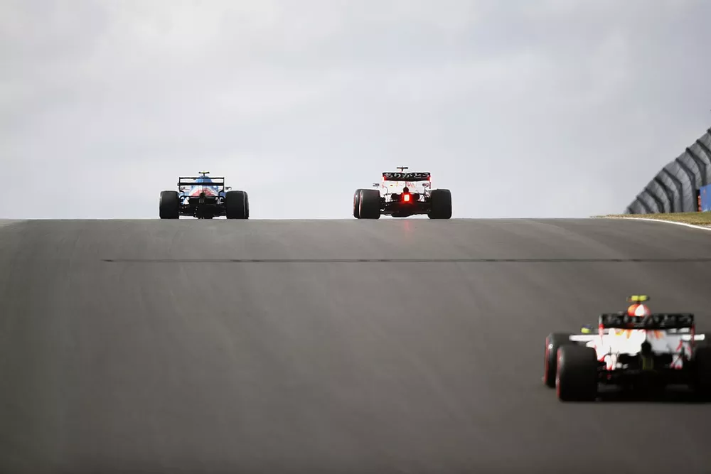 Esteban Ocon, Alpine A521, Max Verstappen, Red Bull Racing RB16B, and Sergio Perez, Red Bull Racing RB16B
