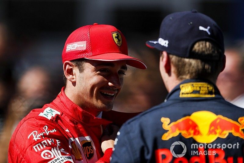 Pole sitter Charles Leclerc, Ferrari, talks with Max Verstappen, Red Bull Racing