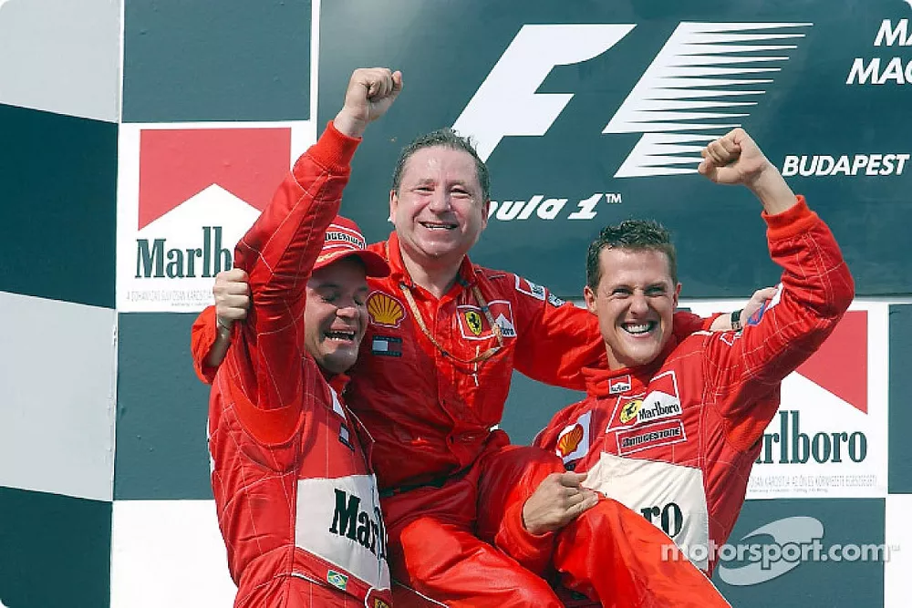 Michael Schumacher, Rubens Barrichello en Jean Todt juichen