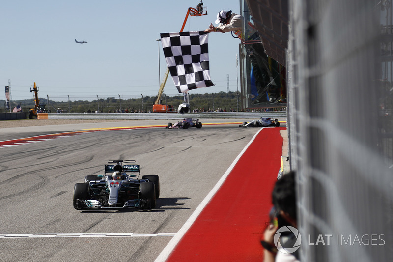 Lewis Hamilton, Mercedes AMG F1 W08, race winner, takes the chequered flag