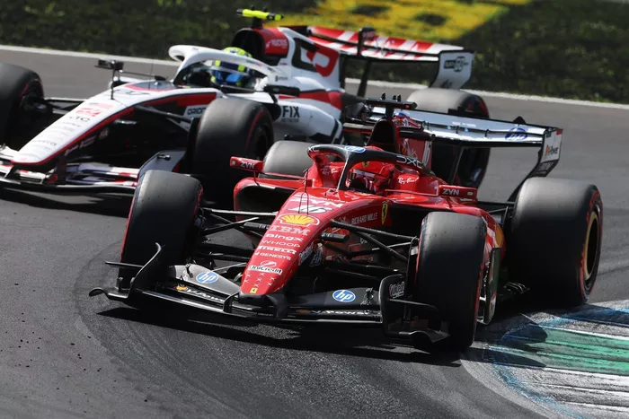 Charles Leclerc, Ferrari, Oliver Bearman, Haas F1 Team