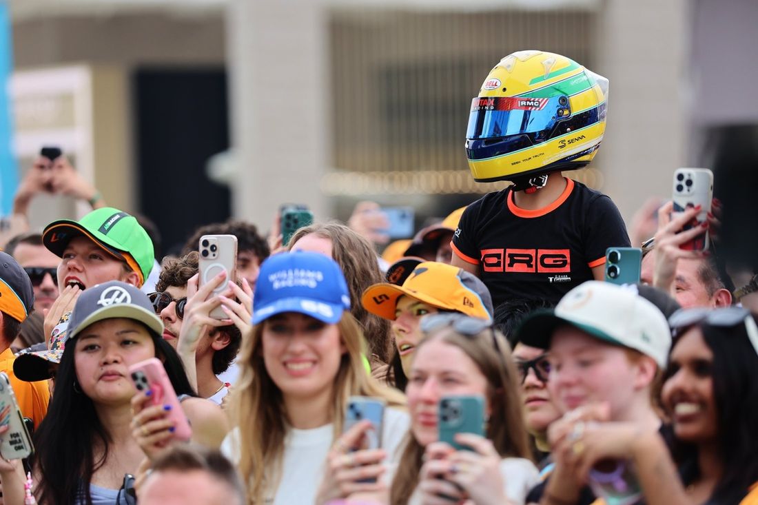A fan in an Ayrton Senna helmet