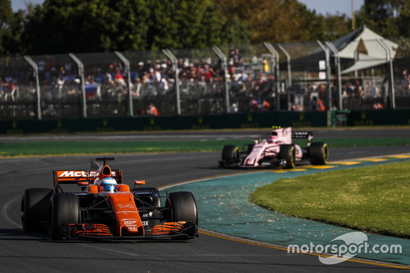 Fernando Alonso, McLaren MCL32, leads Esteban Ocon, Force India VJM10