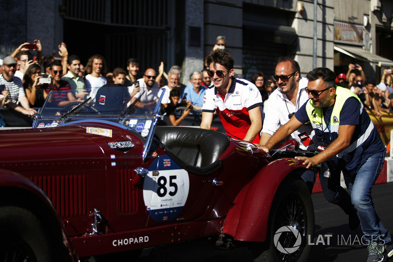 Charles Leclerc, Alfa Romeo Sauber F1 Team helps push a vintage car