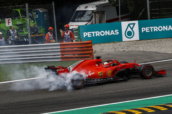 Sebastian Vettel, Ferrari SF71H lighting up his tyres after making contact with Lewis Hamilton, Mercedes AMG F1 W09