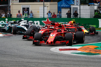 Kimi Raikkonen, Ferrari SF71H, leads Sebastian Vettel, Ferrari SF71H, Lewis Hamilton, Mercedes AMG F1 W09, and Max Verstappen, Red Bull Racing RB14, at the start of the race