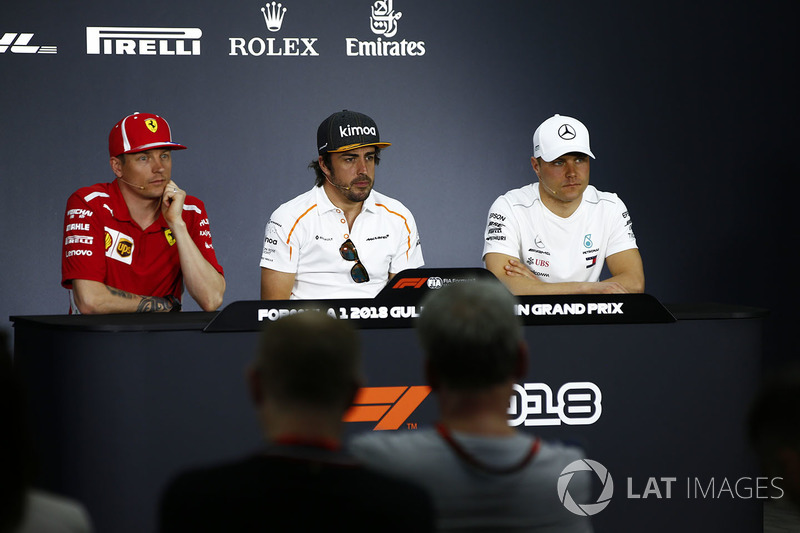 Kimi Raikkonen, Ferrari, Fernando Alonso, McLaren, and Valtteri Bottas, Mercedes AMG F1, in the pres