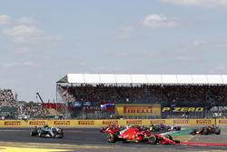 Sebastian Vettel, Ferrari SF-71H leads as Max Verstappen, Red Bull Racing RB14 and Lewis Hamilton, Mercedes-AMG F1 W09