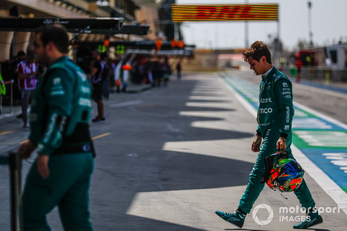 Felipe Drugovich, Aston Martin F1 Team, walks back to the garage after his car stopped on track at the Bahrain test