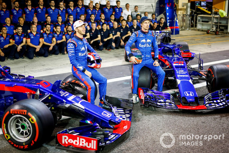 Pierre Gasly, Scuderia Toro Rosso, and Brendon Hartley, Scuderia Toro Rosso, sit for the team photo