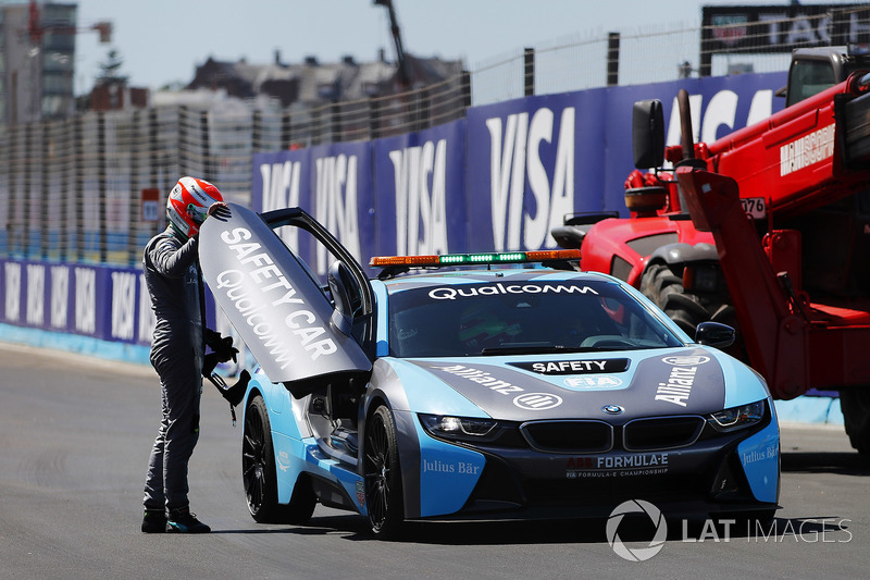 Nelson Piquet Jr., Jaguar Racing, climbs into the BMW i8 safety car after a crash