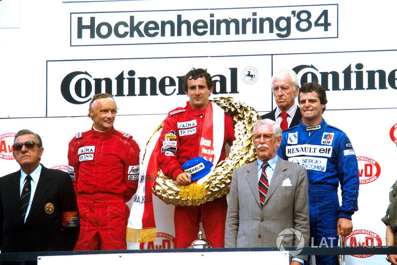 Podium: race winner Alain Prost, second place Niki Lauda, third place Derek Warwick