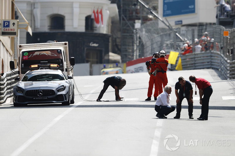 Charlie Whiting, Race Director, FIA, conducts a circuit inspection during a red flag