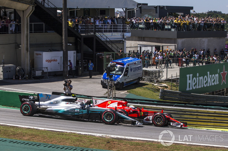 Sebastian Vettel, Ferrari SF70H and Valtteri Bottas, Mercedes-Benz F1 W08  battle for the lead at the start of the race