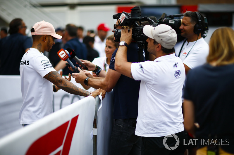 A Fox cameraman films Lewis Hamilton, Mercedes AMG F1