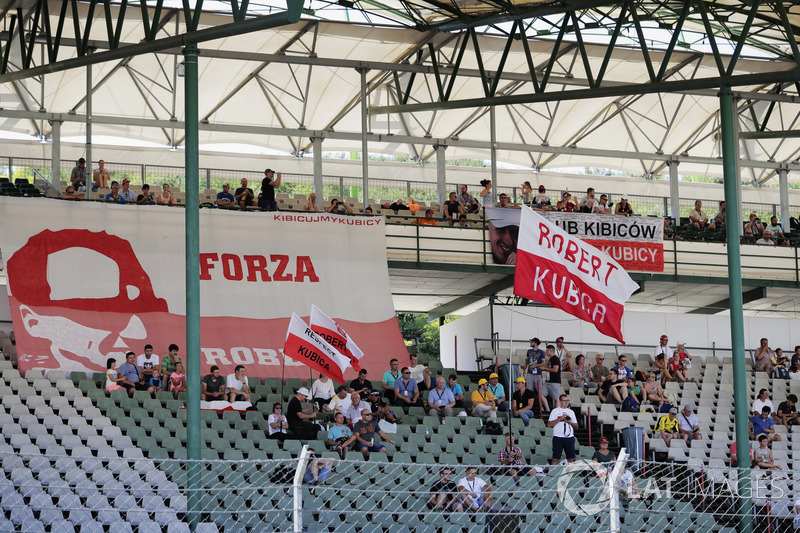 Fans of Robert Kubica, Renault Sport F1 Team, wait in the grandstand