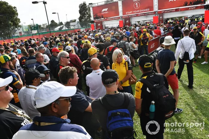 Fans queue at the delayed opening gates