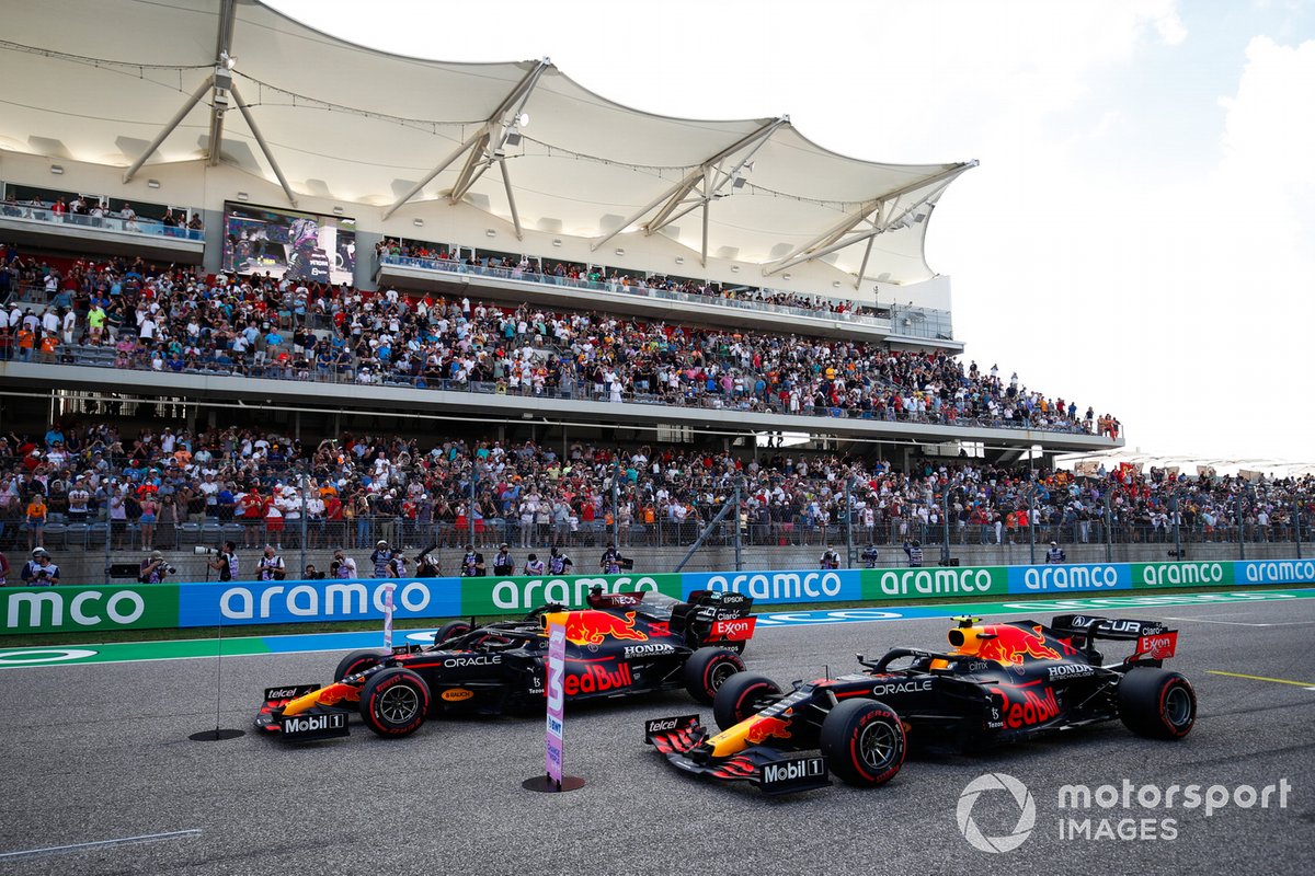 The cars of top three Qualifiers Max Verstappen, Red Bull Racing RB16B, Lewis Hamilton, Mercedes W12, and Sergio Perez, Red Bull Racing RB16B, on the grid