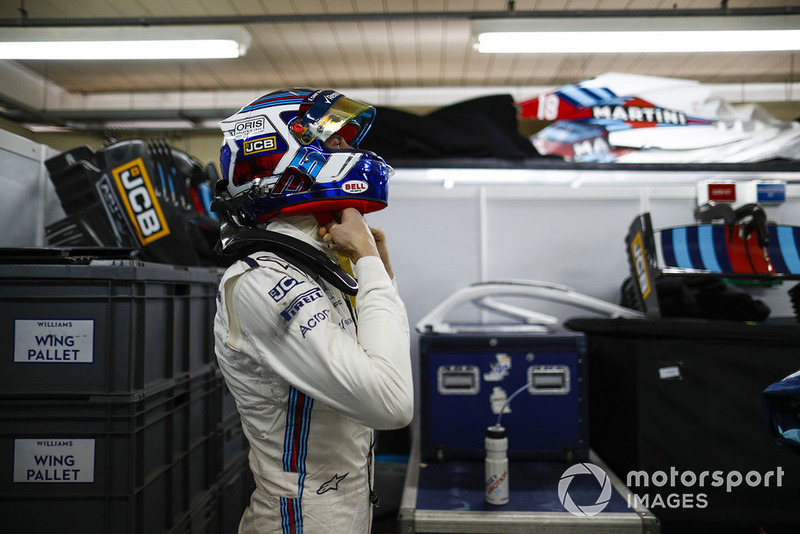Sergey Sirotkin, Williams Racing, adjusts his crash helmet