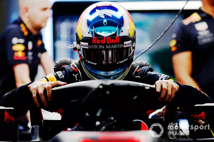 Daniel Ricciardo, Red Bull Racing RB14, climbs in his car in the garage