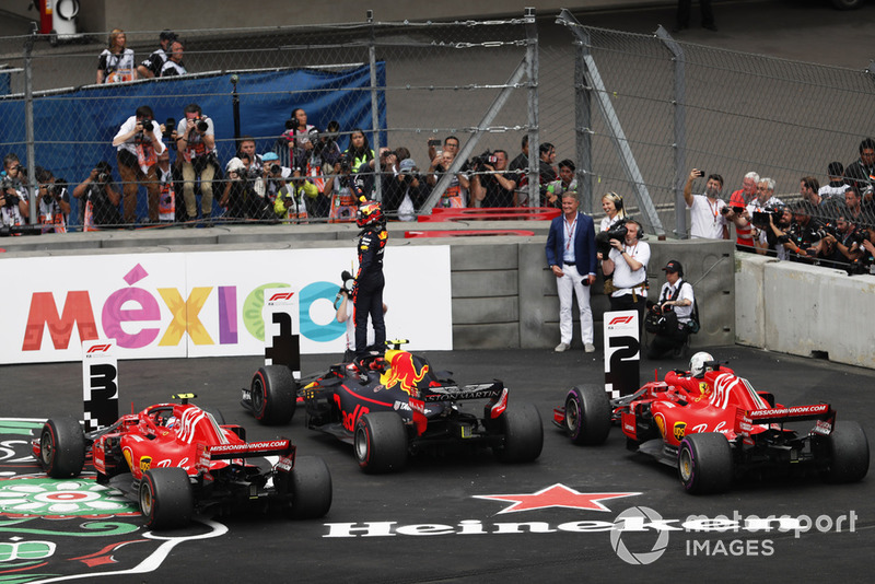 Max Verstappen, Red Bull Racing RB14, celebrates winning the race in parc ferme with Sebastian Vettel, Ferrari SF71H, and Kimi Raikkonen, Ferrari SF71H