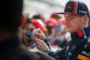 Max Verstappen, Red Bull Racing signs an autograph for a fan
