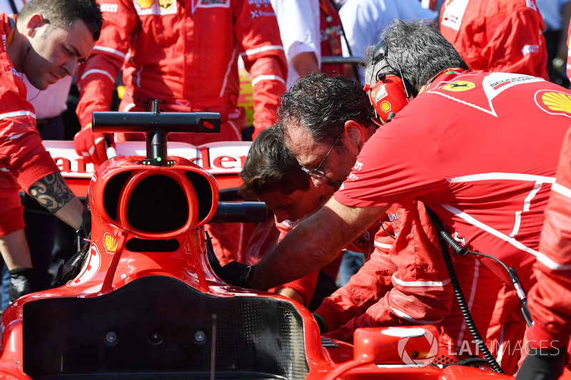 Ferrari mechanics work on the car of Sebastian Vettel, Ferrari SF70H