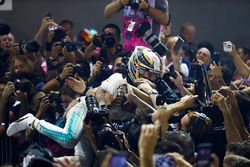 Lewis Hamilton, Mercedes AMG F1 crown surfs after winning the Singapore GP