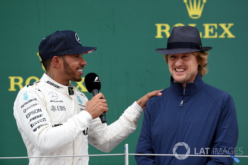 Race winner Lewis Hamilton, Mercedes AMG F1 celebrates and Owen Wilson, Actor on the podium