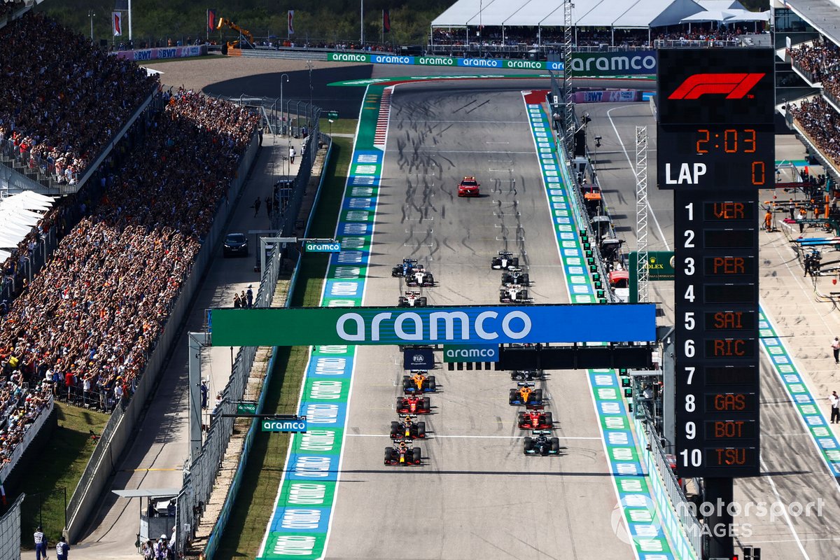 Max Verstappen, Red Bull Racing RB16B, and Lewis Hamilton, Mercedes W12, prepare to lead the field away at the start