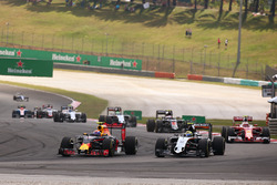 Max Verstappen, Red Bull Racing RB12 and Sergio Perez, Sahara Force India F1 VJM09 battle for position