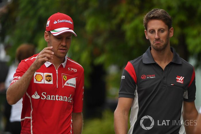 Sebastian Vettel, Ferrari and Romain Grosjean, Haas F1