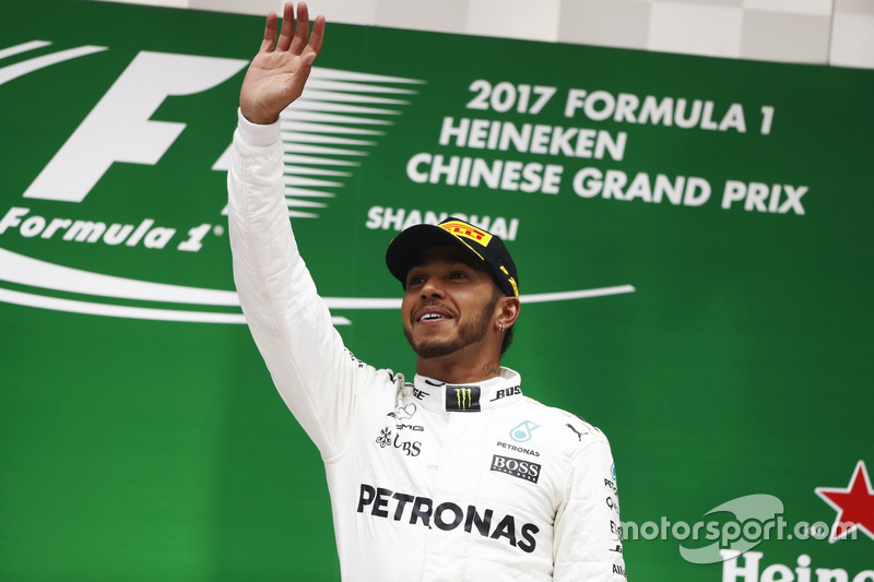 Lewis Hamilton, Mercedes AMG, celebrates taking victory on the podium