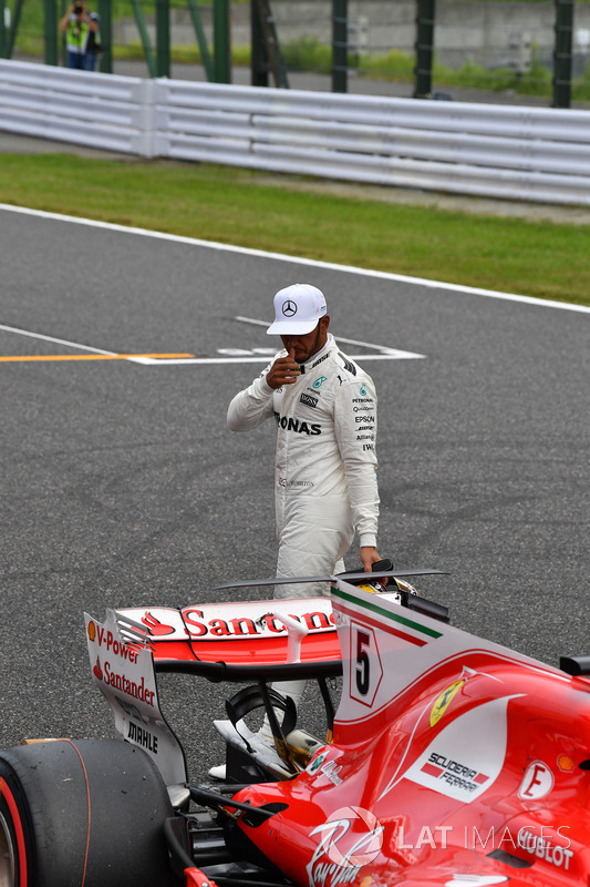 Lewis Hamilton, Mercedes AMG F1 looks at the Ferrari SF70H in parc ferme