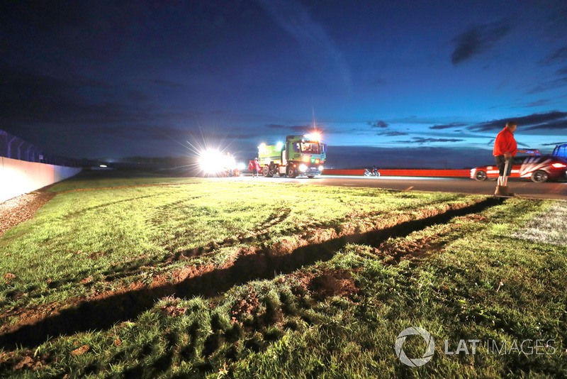 Crews work to improve drainage on the circuit before Sunday's race