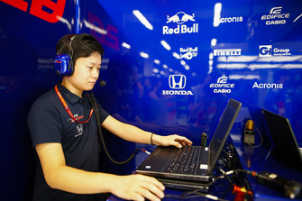 A Toro Rosso Honda engineer at work on a laptop