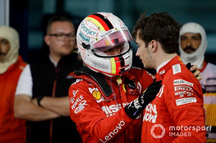 Sebastian Vettel, Ferrari, talks to his team mate Charles Leclerc, Ferrari, 3rd position, after the race