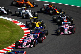 Sergio Perez, Racing Point Force India VJM11, leads Esteban Ocon, Racing Point Force India VJM11, Carlos Sainz Jr., Renault Sport F1 Team R.S. 18, Kevin Magnussen, Haas F1 Team VF-18, Daniel Ricciardo, Red Bull Racing RB14, Charles Leclerc, Sauber C37, Fernando Alonso, McLaren MCL33, and Lance Stroll, Williams FW41, at the start