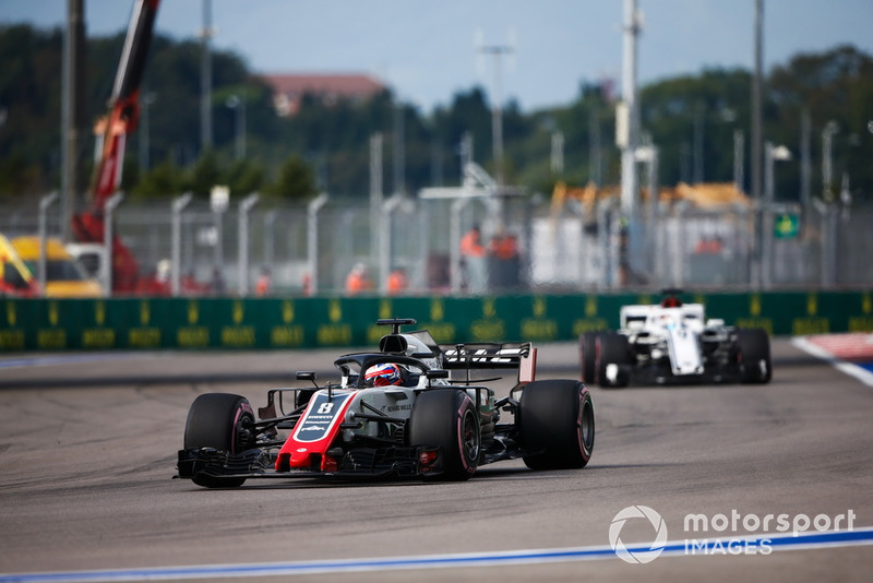 Romain Grosjean, Haas F1 Team VF-18, leads Marcus Ericsson, Sauber C37