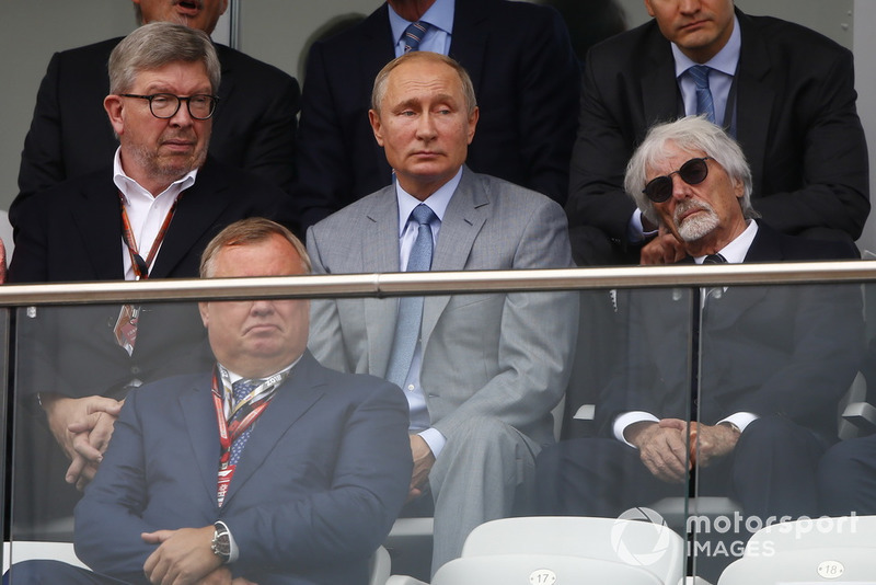 Ross Brawn, Managing Director of Motorsports, FOM, Vladimir Putin, President of Russia, and Bernie Ecclestone, Chairman Emeritus of Formula 1, watch the race 