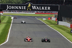 Sebastian Vettel, Ferrari SF16-H and Jenson Button, McLaren MP4-31 battle for position