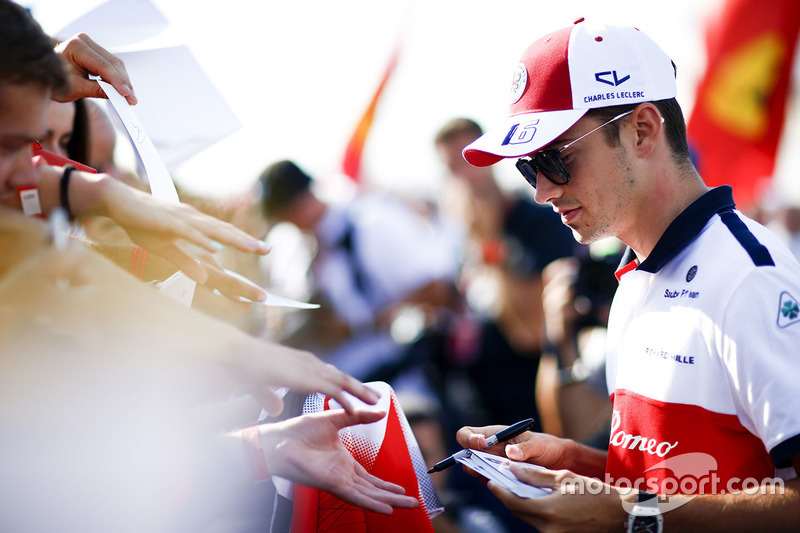 Charles Leclerc, Sauber, signs an autograph for fans