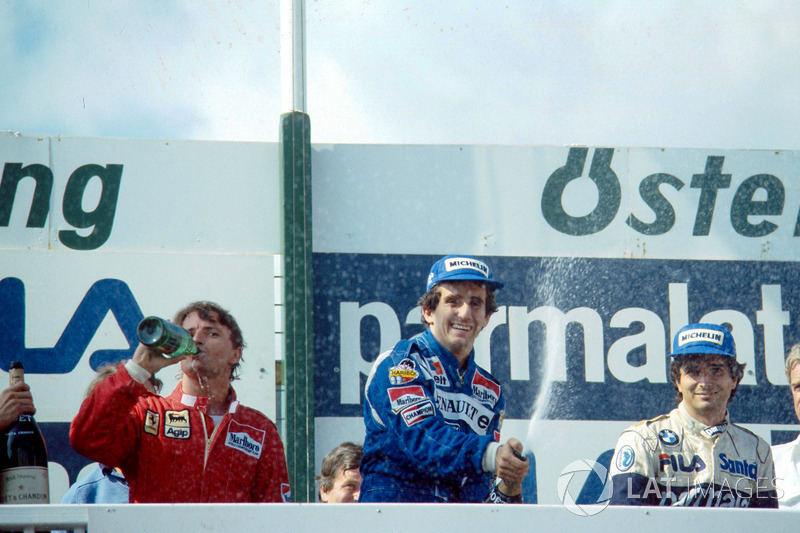 Podium: race winner Alain Prost, second place René Arnoux, third place Nelson Piquet